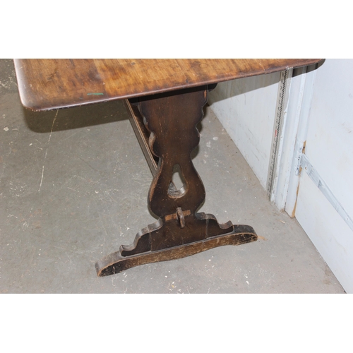 18 - A vintage 4 plank refectory table, likely Ercol