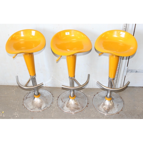 2 - 3 vintage style yellow and chrome bar stools