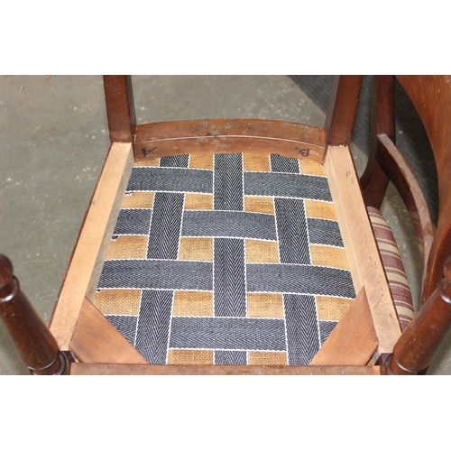 20 - A set of 4 19th century mahogany dining chairs with scroll backs, each one stamped GH