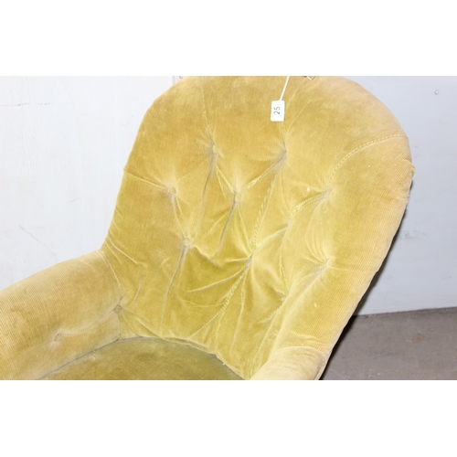 25 - A Victorian button backed low armchair with green corduroy upholstery