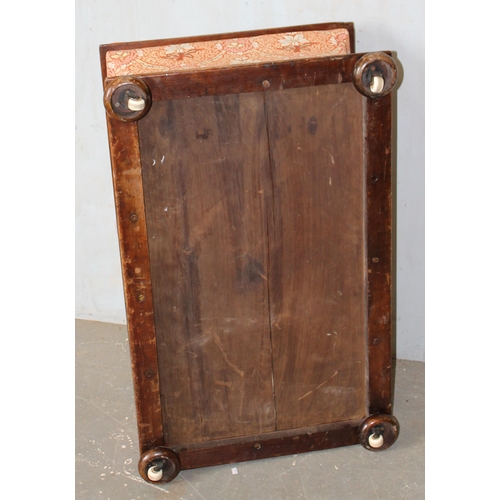 32 - An antique mahogany sarcophagus shaped ottoman with later upholstery and patent ceramic castors