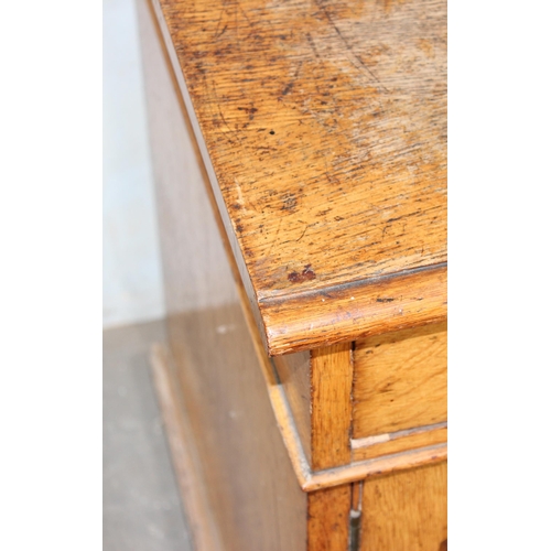 37 - A small vintage oak cupboard with one long drawer, approx 107cm wide
