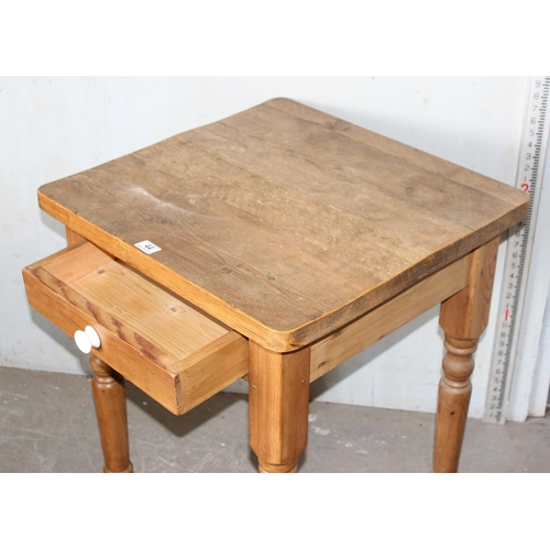 44 - A small square pine kitchen table with drawer