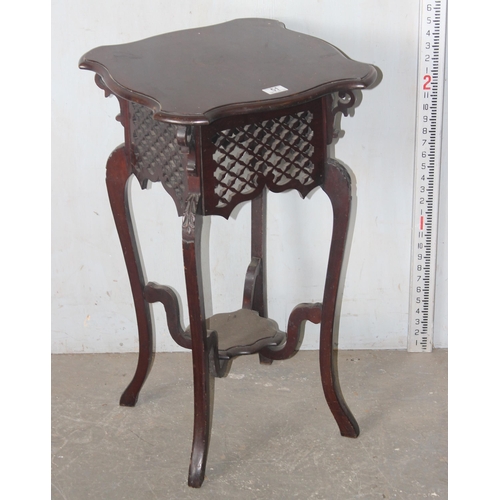 51 - An early 20th century mahogany Art Nouveau side table or Jardiniere stand with interesting pierced f... 