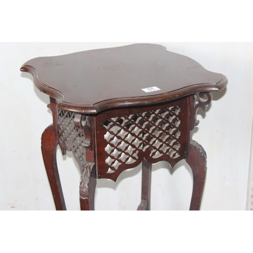 51 - An early 20th century mahogany Art Nouveau side table or Jardiniere stand with interesting pierced f... 
