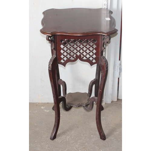 51 - An early 20th century mahogany Art Nouveau side table or Jardiniere stand with interesting pierced f... 