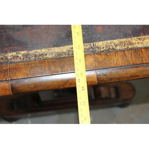 7 - A 19th century rosewood library table table with gilt tooled leather insert, the base with turned st... 