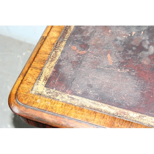 7 - A 19th century rosewood library table table with gilt tooled leather insert, the base with turned st... 
