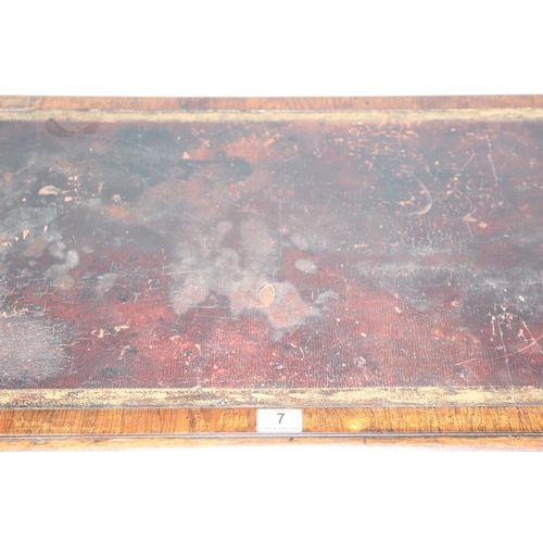 7 - A 19th century rosewood library table table with gilt tooled leather insert, the base with turned st... 