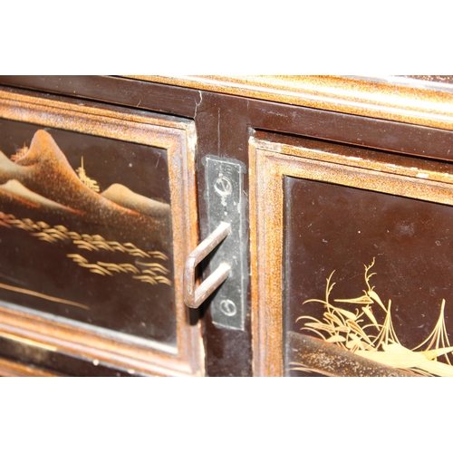 8 - An antique Japanese lacquered cabinet on stand with brass fittings and original key, likely c.1800 o... 