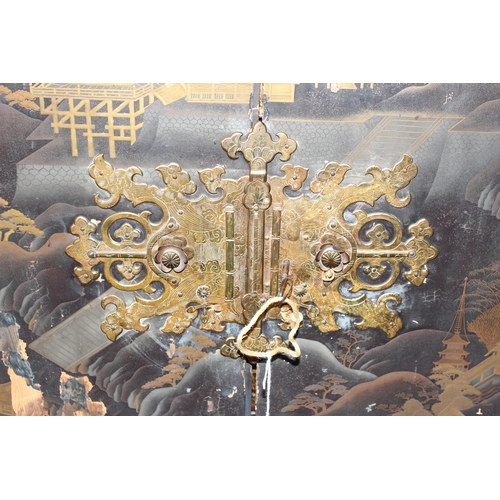 8 - An antique Japanese lacquered cabinet on stand with brass fittings and original key, likely c.1800 o... 