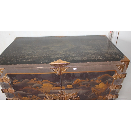 8 - An antique Japanese lacquered cabinet on stand with brass fittings and original key, likely c.1800 o... 