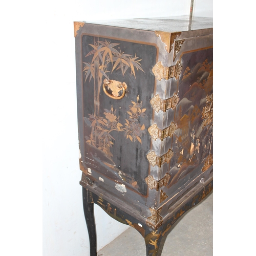 8 - An antique Japanese lacquered cabinet on stand with brass fittings and original key, likely c.1800 o... 