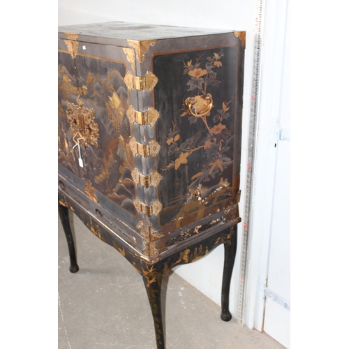 8 - An antique Japanese lacquered cabinet on stand with brass fittings and original key, likely c.1800 o... 