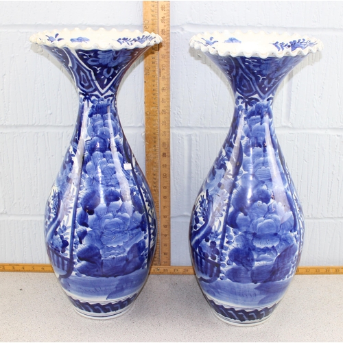 1628A - A large pair of Japanese blue and white porcelain floor vases of bottle form with frilled rim, likel... 