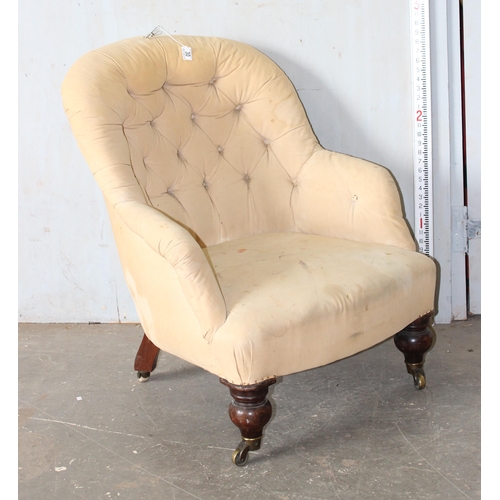 30A - A 19th century button backed armchair with brass and ceramic castors  stamped Charlton's Patent