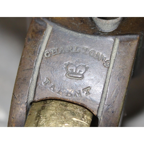 30A - A 19th century button backed armchair with brass and ceramic castors  stamped Charlton's Patent