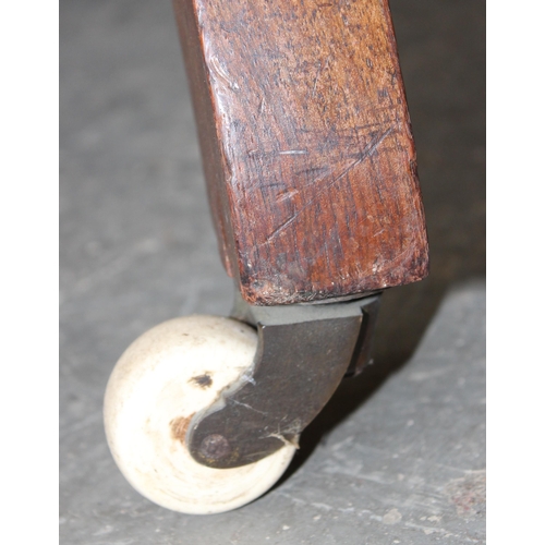 30A - A 19th century button backed armchair with brass and ceramic castors  stamped Charlton's Patent