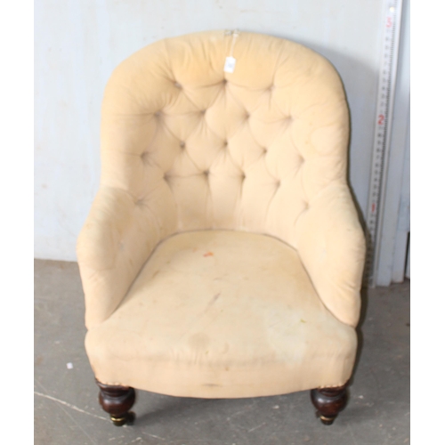 30A - A 19th century button backed armchair with brass and ceramic castors  stamped Charlton's Patent