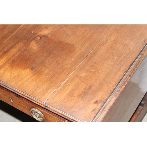 2 - A Regency mahogany sofa table, the top with hinged sides, two frieze drawers on turned end columns a... 