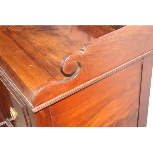 4 - An early 19th century mahogany breakfront sideboard, the galleried top above central drawer with cup... 