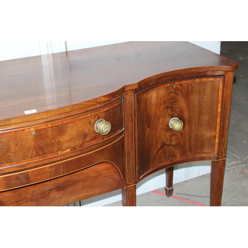 7 - A George III mahogany serpentine sideboard cross banded in kingwood, with central drawer and conceal... 