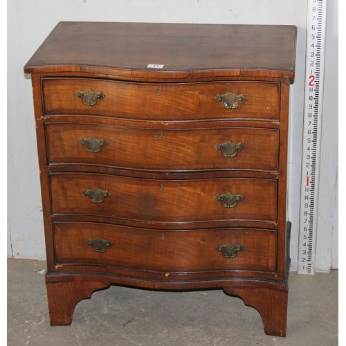 11 - An antique mahogany serpentine chest, crossbanded, with four long drawers 2’2 1/2” wide