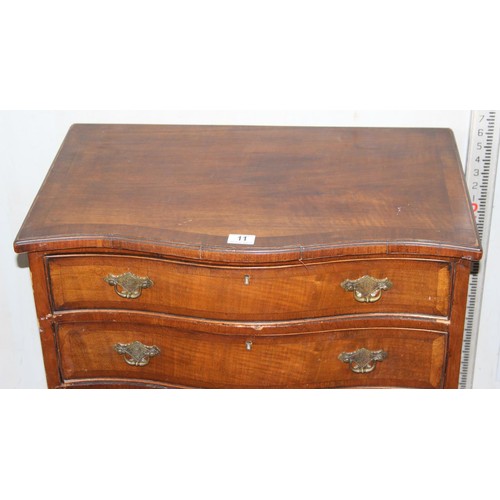 11 - An antique mahogany serpentine chest, crossbanded, with four long drawers 2’2 1/2” wide