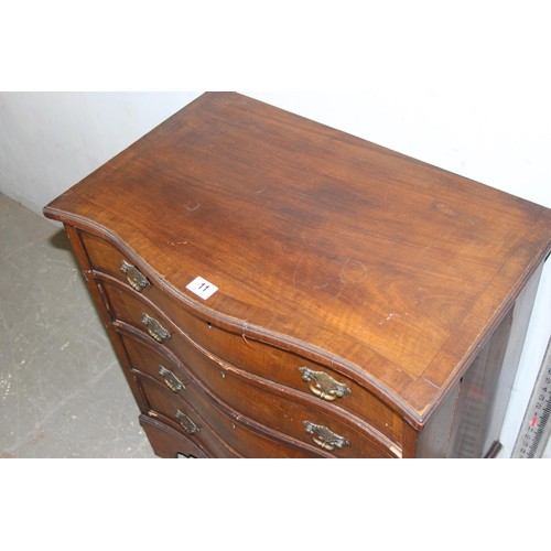 11 - An antique mahogany serpentine chest, crossbanded, with four long drawers 2’2 1/2” wide