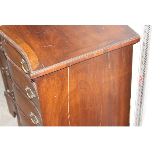 11 - An antique mahogany serpentine chest, crossbanded, with four long drawers 2’2 1/2” wide