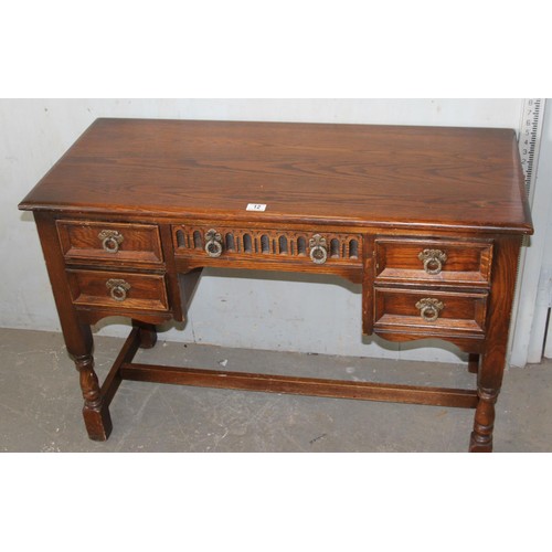 12 - Small oak writing desk, with 5 drawers, approx 42” wide, 29” tall