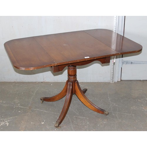 13 - An antique style sofa table, the top with hinged sides, on central pillar with four legs, approx 4ft... 