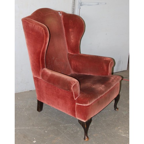 26 - A Georgian style plumb coloured velvet upholstered wingback armchair