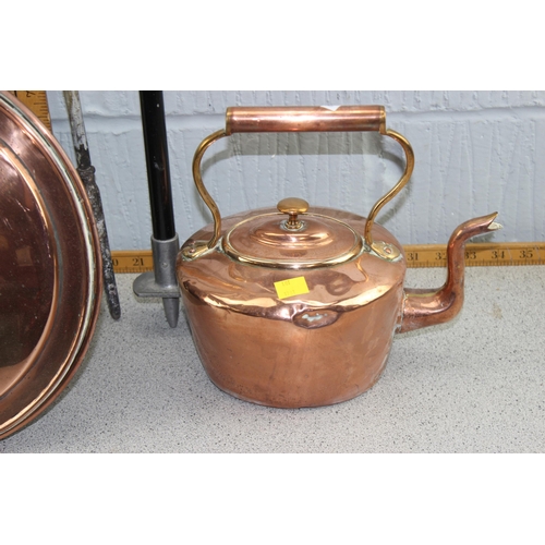 1701 - An antique copper bed warming pan, a copper kettle, brass poker and a shooting stick (4)