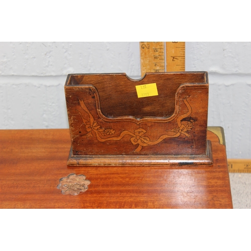 1703 - A vintage wooden writing slope, lacking interior, brass and wooden clock and a vintage letter rack (... 