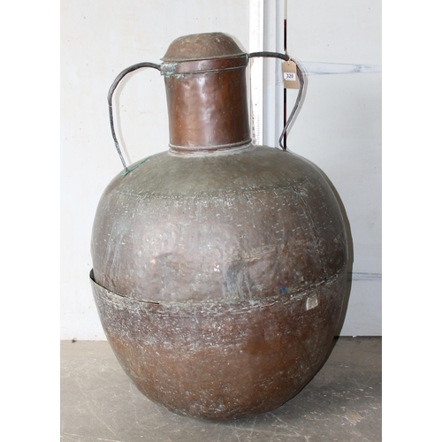 320 - An extremely large Islamic copper distillation pot with ironwork mountings, likely 19th century or e... 