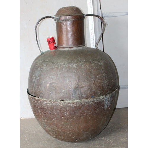 320 - An extremely large Islamic copper distillation pot with ironwork mountings, likely 19th century or e... 