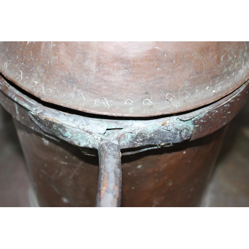 320 - An extremely large Islamic copper distillation pot with ironwork mountings, likely 19th century or e... 