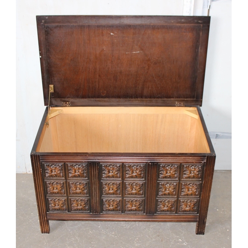 38 - A vintage oak ottoman or storage box with carved details