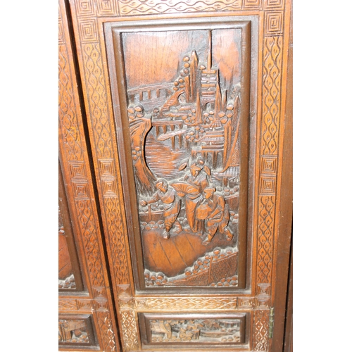 39 - An unusual mid 20th century Chinese carved buffet or side cabinet