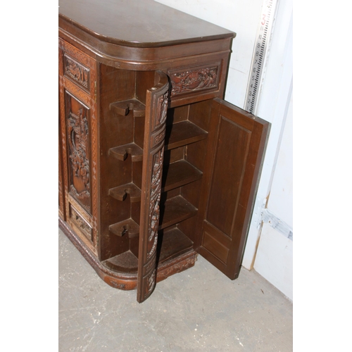 39 - An unusual mid 20th century Chinese carved buffet or side cabinet