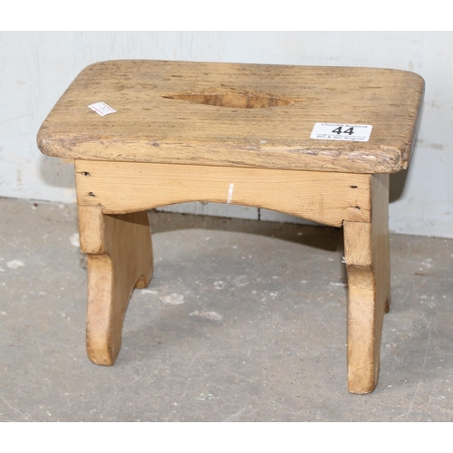 44 - A small antique pine and elm milking stool