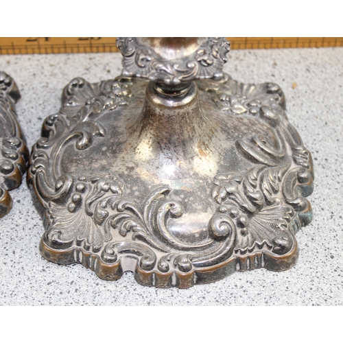 1103 - A pair of antique Rococo style silver plated candlesticks