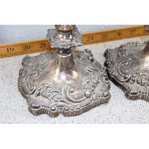 1103 - A pair of antique Rococo style silver plated candlesticks