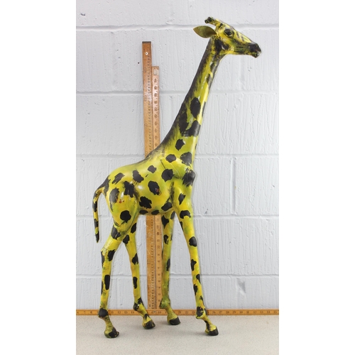 1717 - A large painted leather giraffe, approx 110cm tall