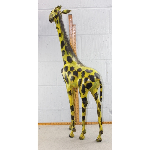 1717 - A large painted leather giraffe, approx 110cm tall