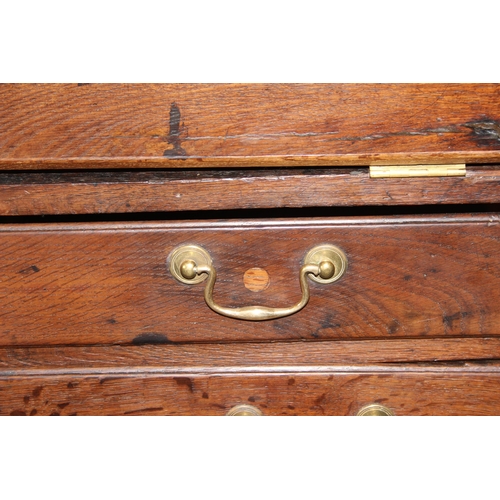 28 - An antique oak bureau, 2/3 drawers with brass fittings