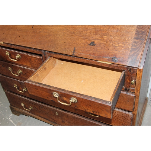 28 - An antique oak bureau, 2/3 drawers with brass fittings