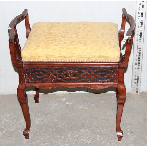 32 - An antique Victorian mahogany rise and fall piano stool with fretwork designed pierced sides and gol... 