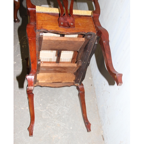 32 - An antique Victorian mahogany rise and fall piano stool with fretwork designed pierced sides and gol... 